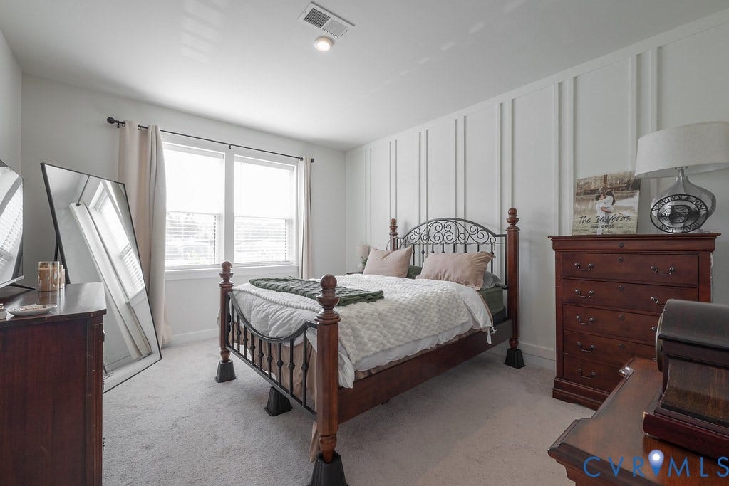 4000 Maze Runner Drive, #101, Midlothian, VA 23112 Carpeted room featuring a decorative accent wall, recessed lighting, and dual windows with blinds