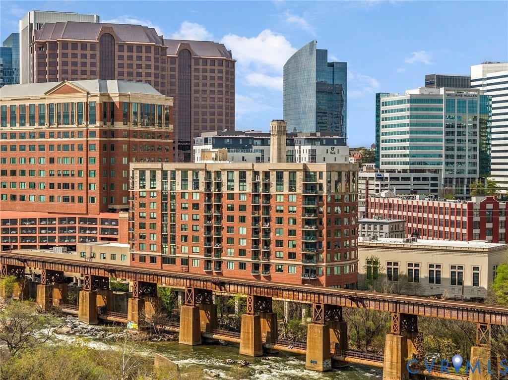 1101 Haxall Point, #U514, Richmond, VA 23219 Urban setting featuring a river, railway bridge, and high-rise buildings with diverse architectural styles