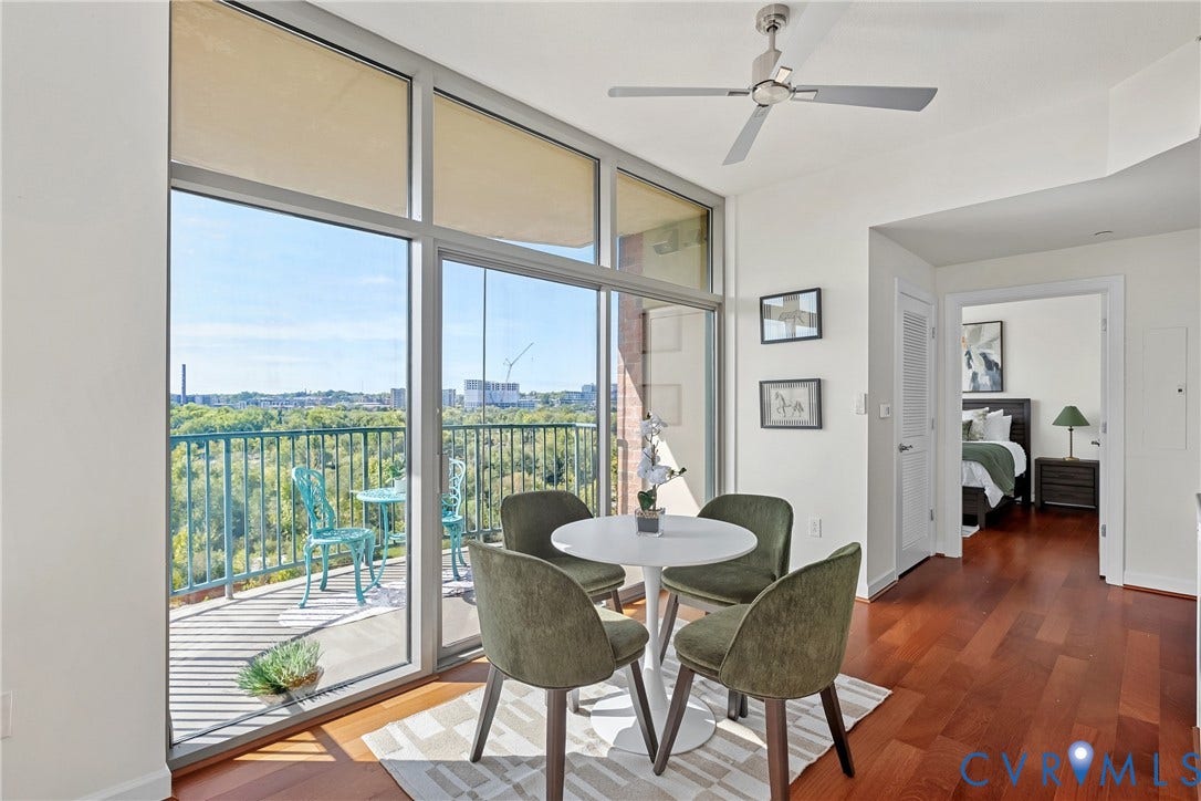 1101 Haxall Point, #U514, Richmond, VA 23219 Floor-to-ceiling windows, outdoor balcony, wood-finish flooring, recessed lighting, and a contemporary ceiling fan