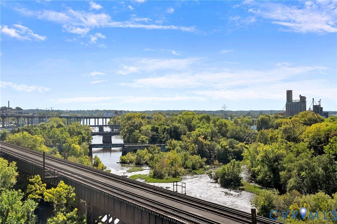 1101 Haxall Point, #U514, Richmond, VA 23219 Expansive landscape featuring a river, mature trees, multiple bridges, and distant industrial structures under a clear sky