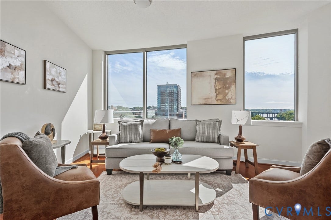 1101 Haxall Point, #U514, Richmond, VA 23219 Expansive windows with city and water views, wood-finish flooring, and white painted walls