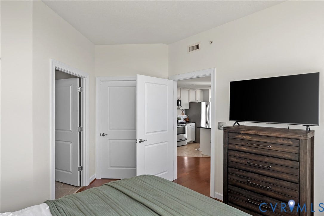 1101 Haxall Point, #U514, Richmond, VA 23219 Wood-finish flooring, white paneled doors, and light-colored walls