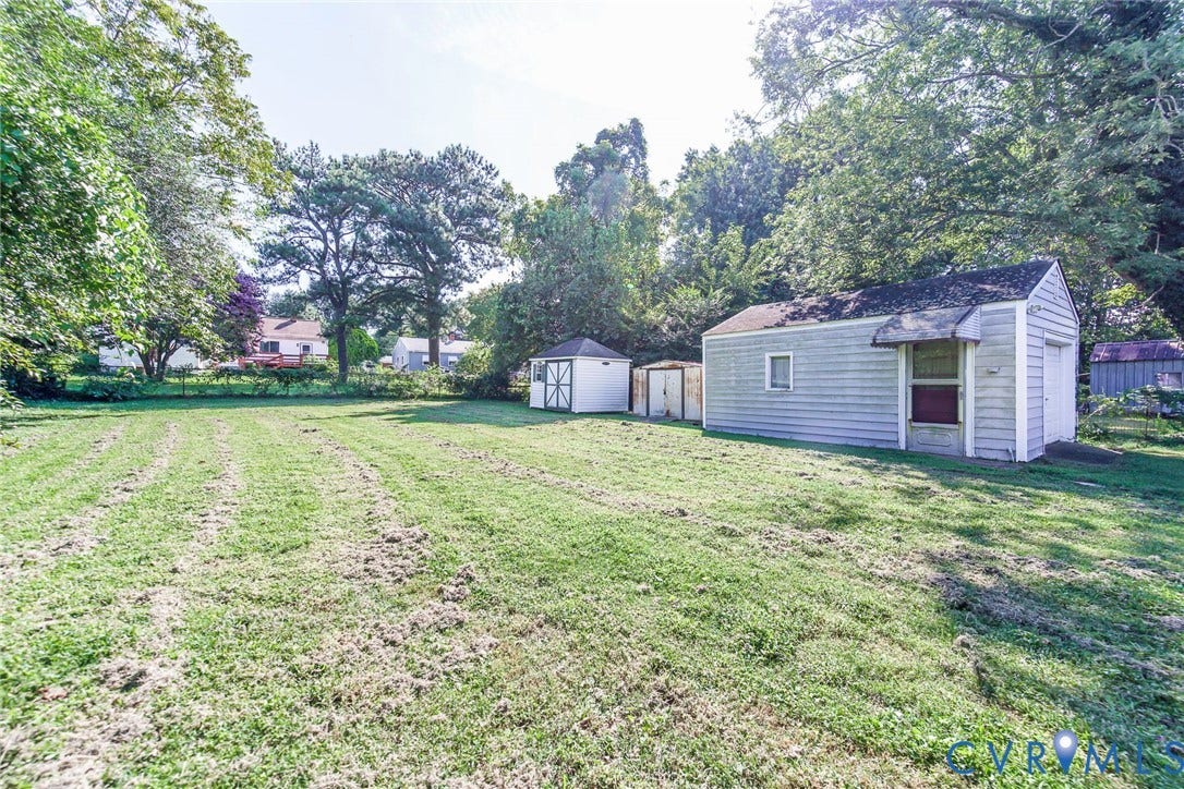 Backyard with 2 large detached sheds