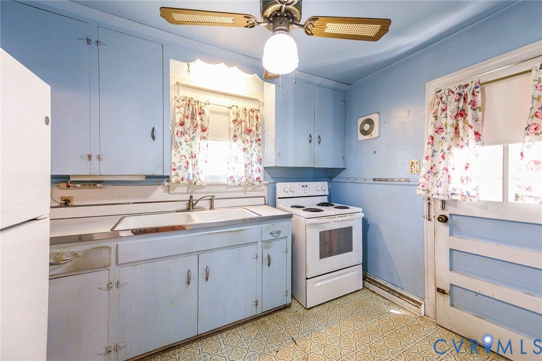 Kitchen with door leading to backyard