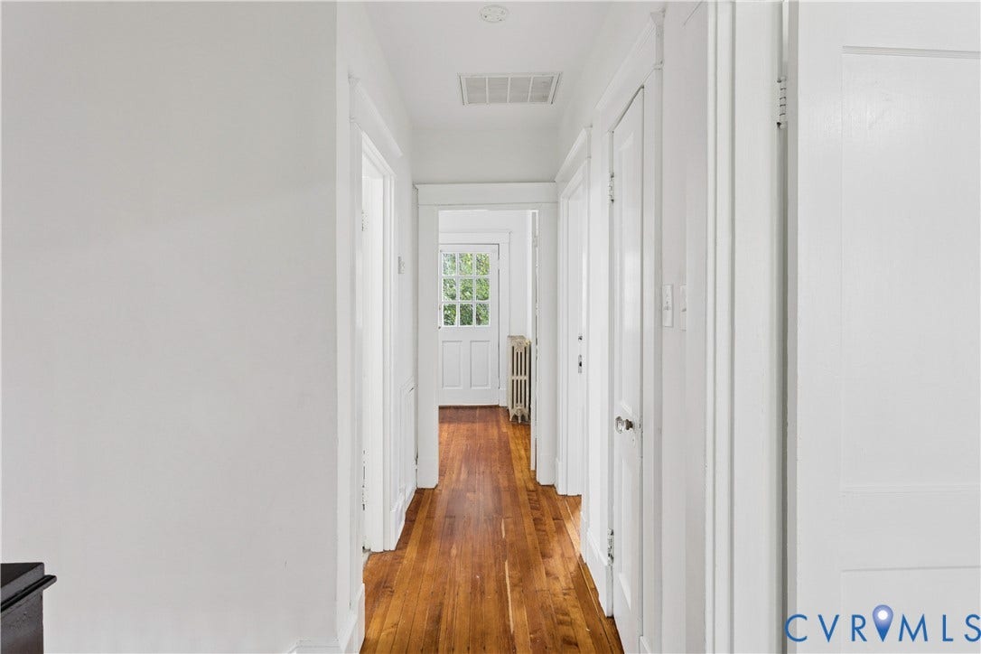 1304 Bainbridge Street, Manchester, Richmond, VA 23224 Hardwood flooring throughout, white painted walls, and white trim