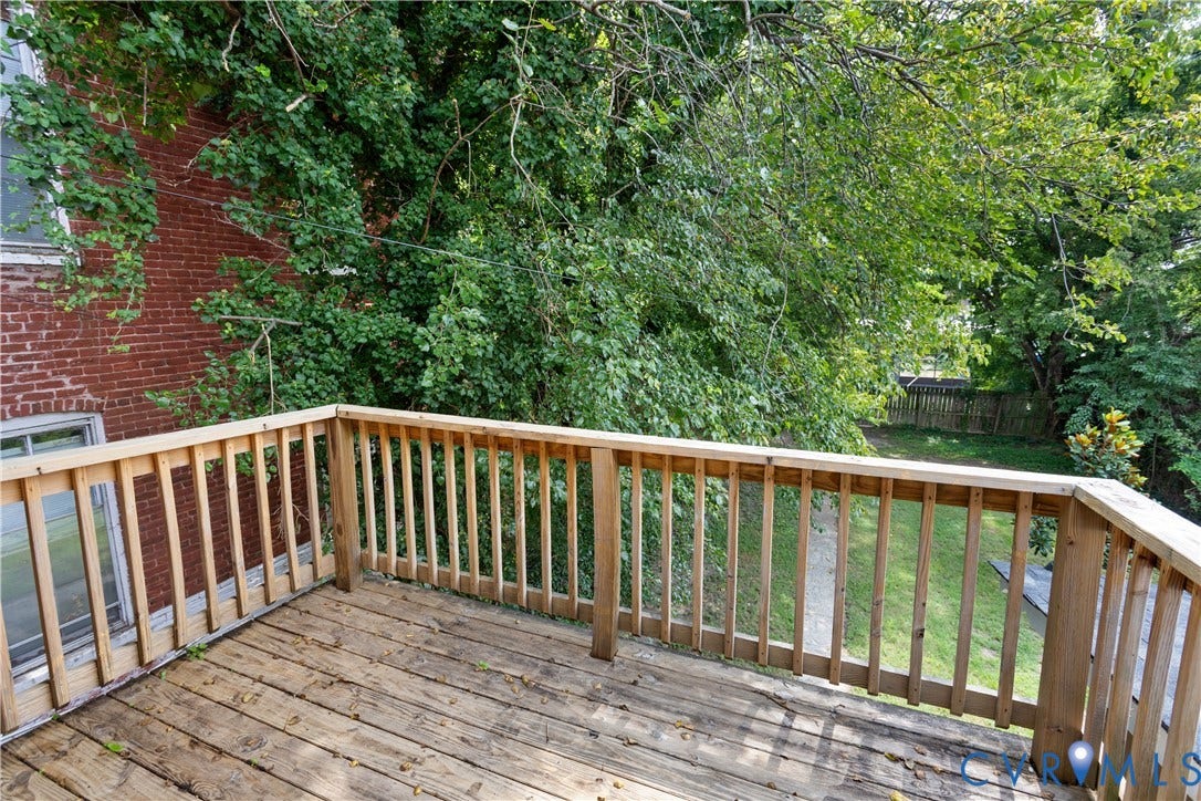 1304 Bainbridge Street, Manchester, Richmond, VA 23224 Outdoor deck featuring natural wood railing and wood plank flooring