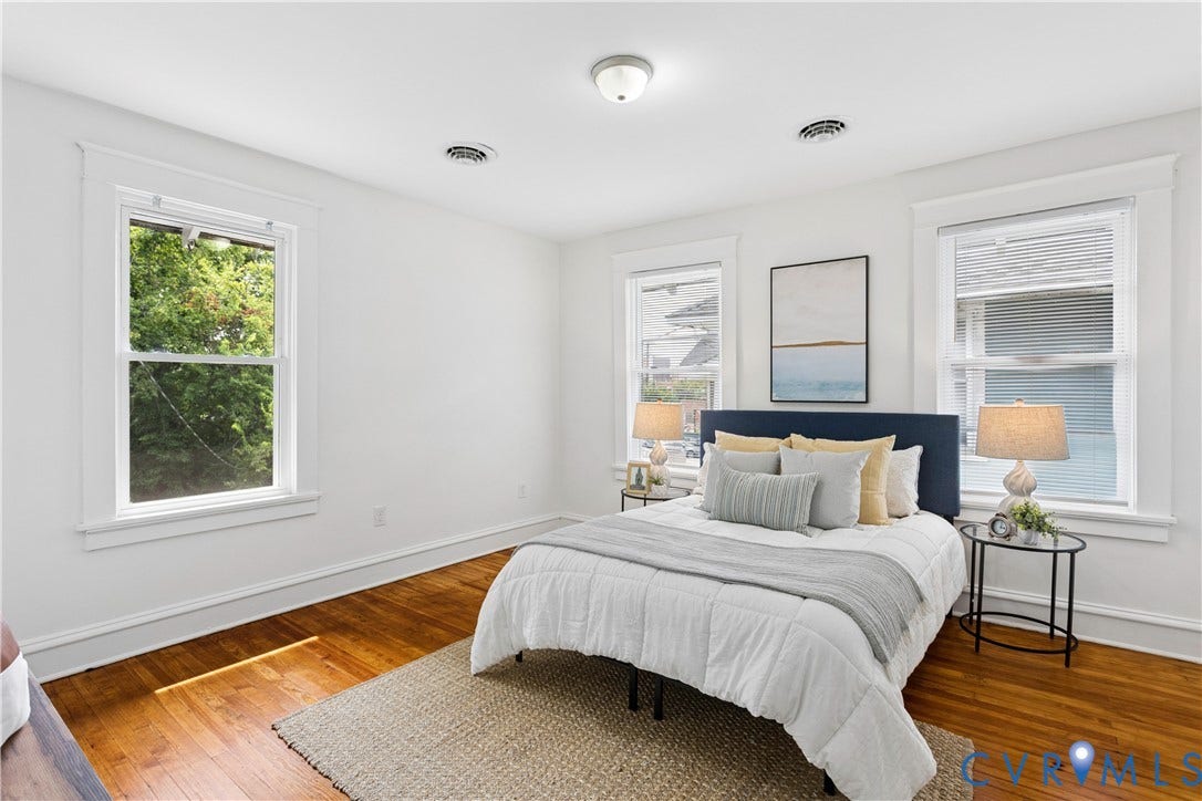 1304 Bainbridge Street, Manchester, Richmond, VA 23224 Hardwood flooring, multiple windows with white trim, recessed lighting, and a white ceiling fixture