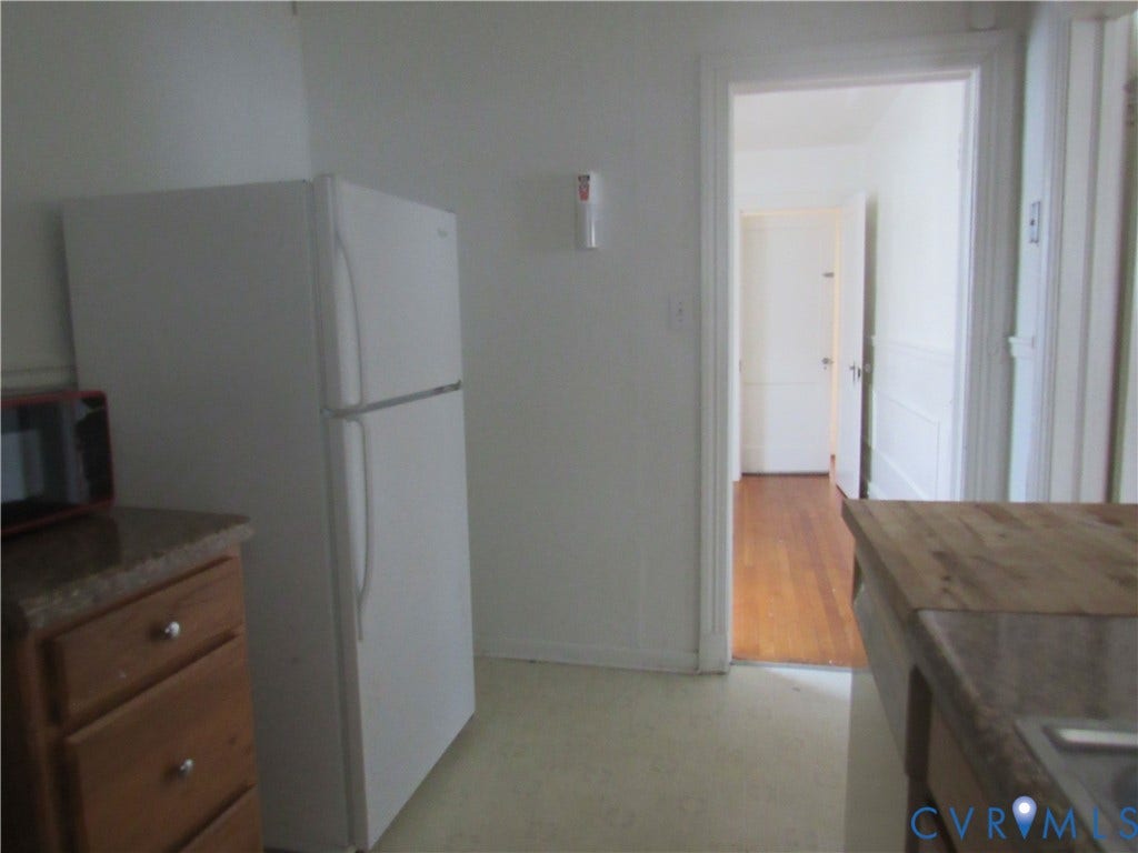 Built-in cabinetry with wood-finish drawers and stone-finish countertops