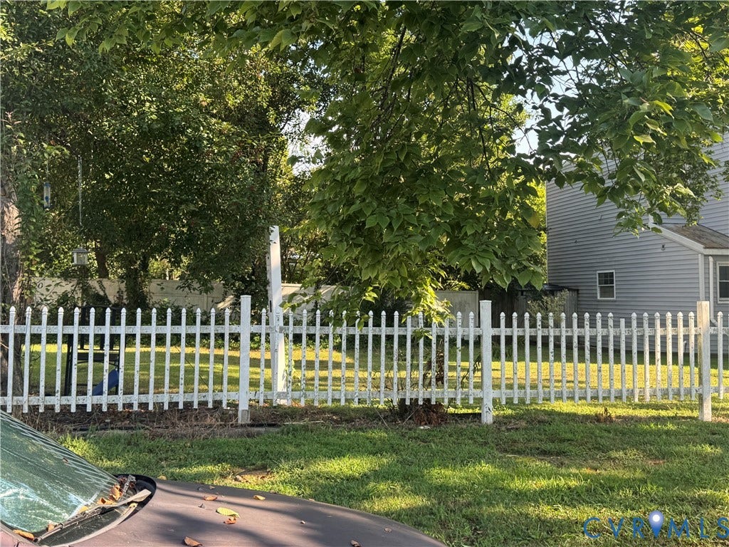 1520 2/3 National Street, Fulton, Richmond, VA 23231 White picket fence enclosing a grassy yard