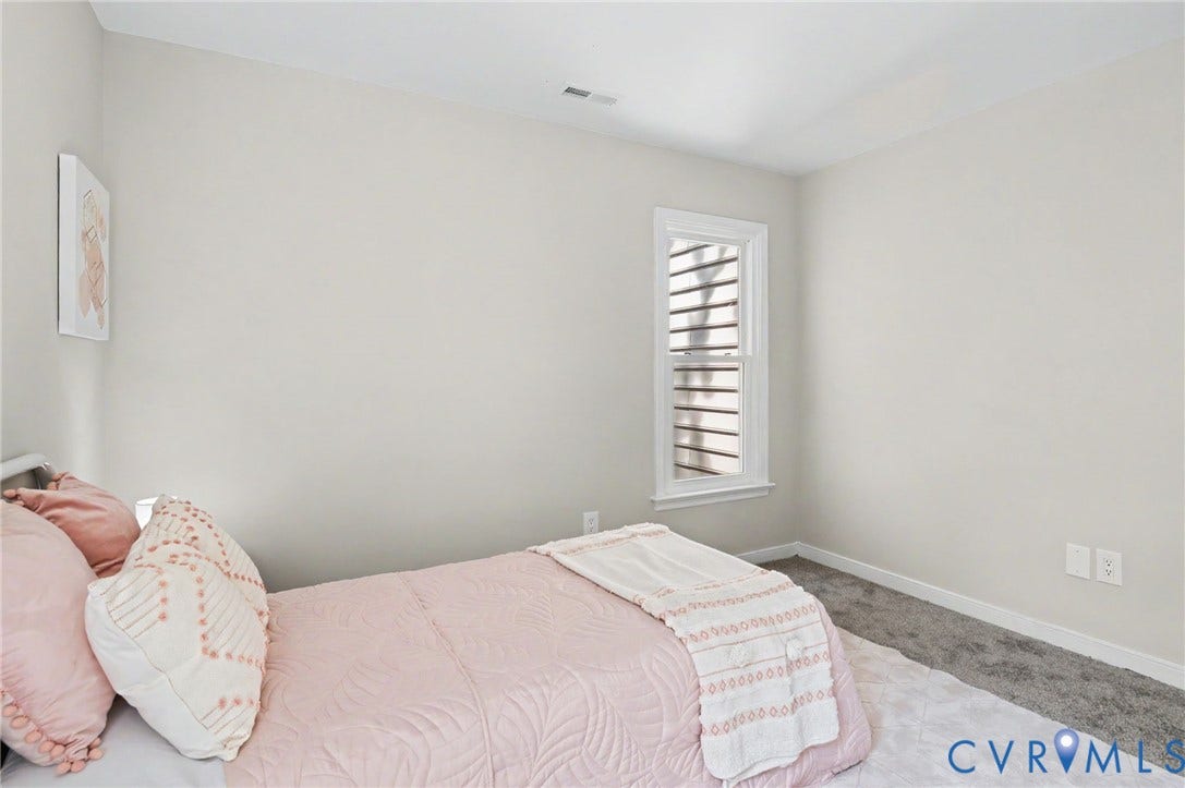 Neutral wall paint, white trim, and a double-hung window