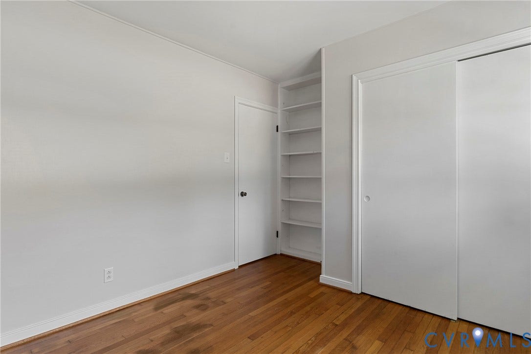 5968 Forest Hill Avenue, Westlake Hills, Richmond, VA 23225 Hardwood flooring, built-in shelving, two white doors, and light-toned walls