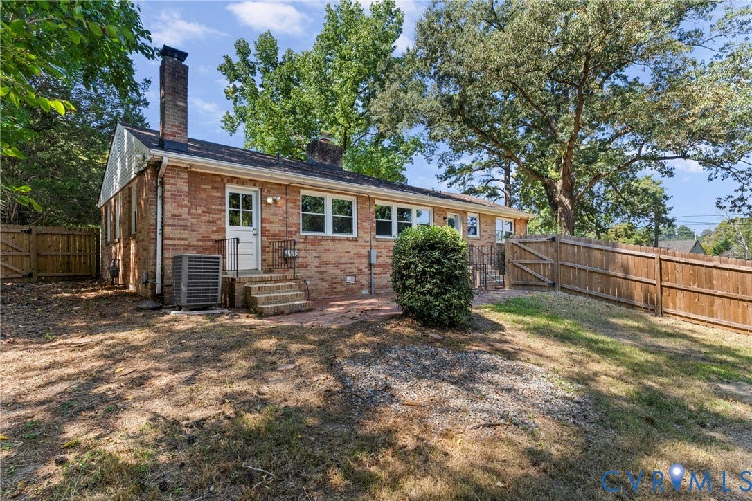 5968 Forest Hill Avenue, Westlake Hills, Richmond, VA 23225 Brick exterior with multiple windows and a wooden privacy fence