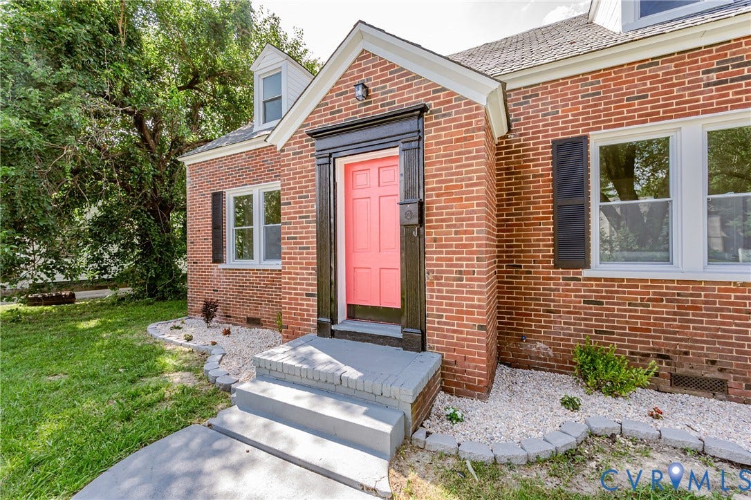 4008 River Road, Chesterfield, VA 23803 Brick exterior with white trim, featuring a vibrant front door with dark surround