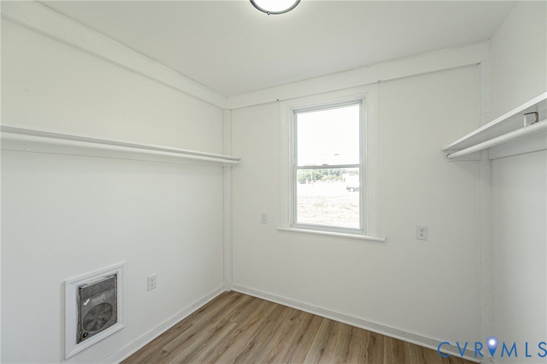 4008 River Road, Chesterfield, VA 23803 Wood-finish flooring, white walls, and a ceiling-mounted light fixture