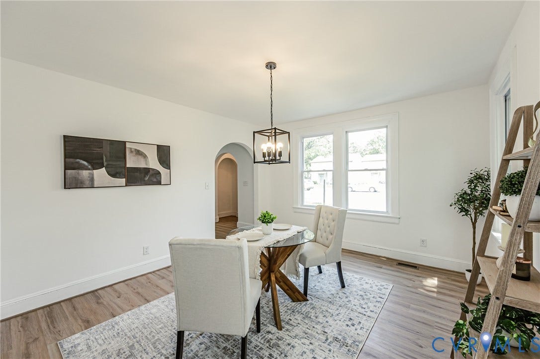 4008 River Road, Chesterfield, VA 23803 Light-filled interior featuring wood-finish flooring, an arched doorway, and a contemporary chandelier