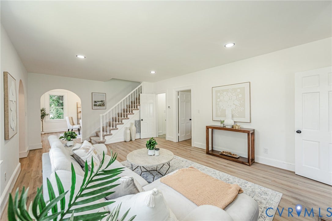 4008 River Road, Chesterfield, VA 23803 Light wood-finish flooring throughout, recessed ceiling lighting, arched doorway, panel doors, and a carpeted staircase with white balusters