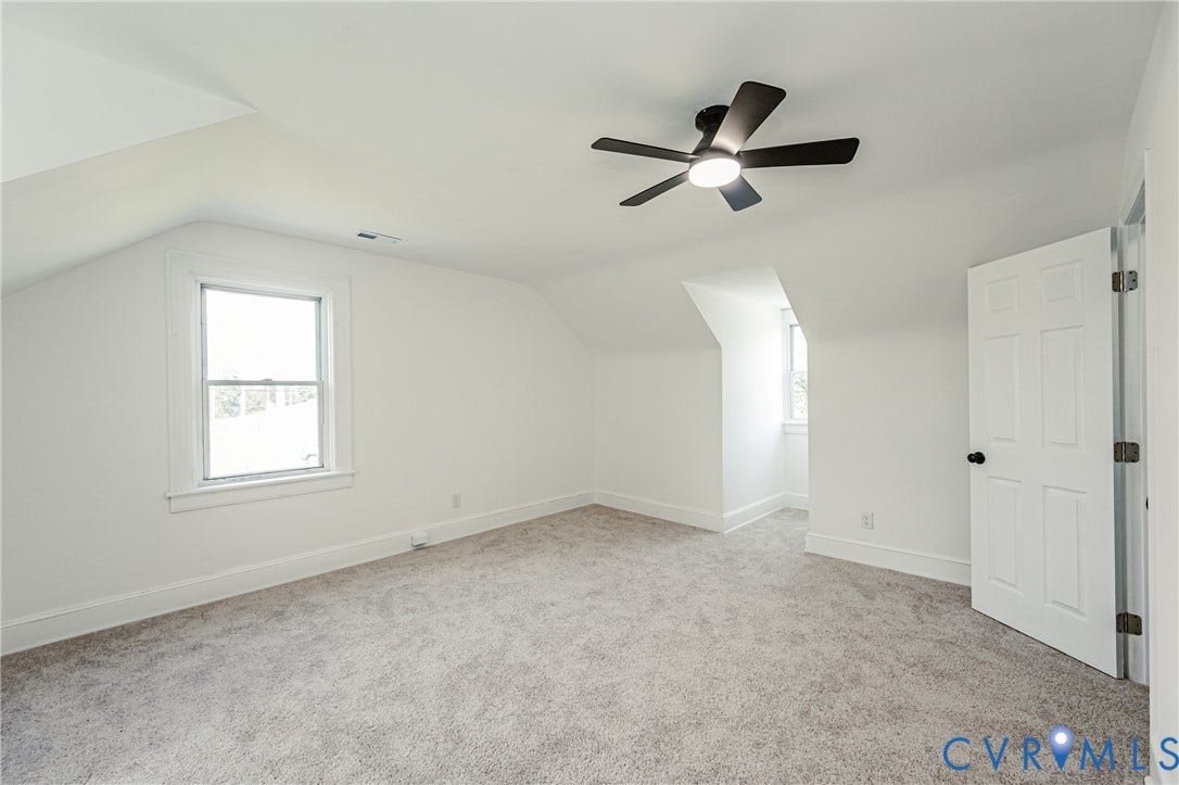4008 River Road, Chesterfield, VA 23803 Carpeted room featuring a ceiling fan with integrated lighting, multiple windows, and a six-panel door