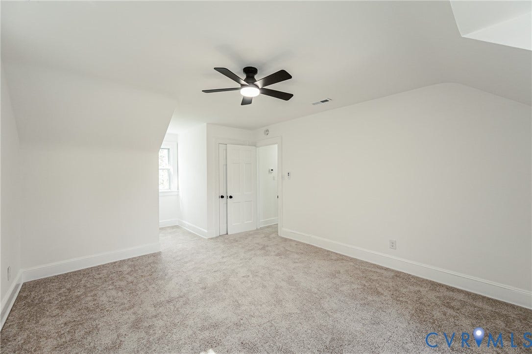 4008 River Road, Chesterfield, VA 23803 Recessed window with natural light, neutral carpeting, crisp white walls, and a ceiling fan with integrated lighting