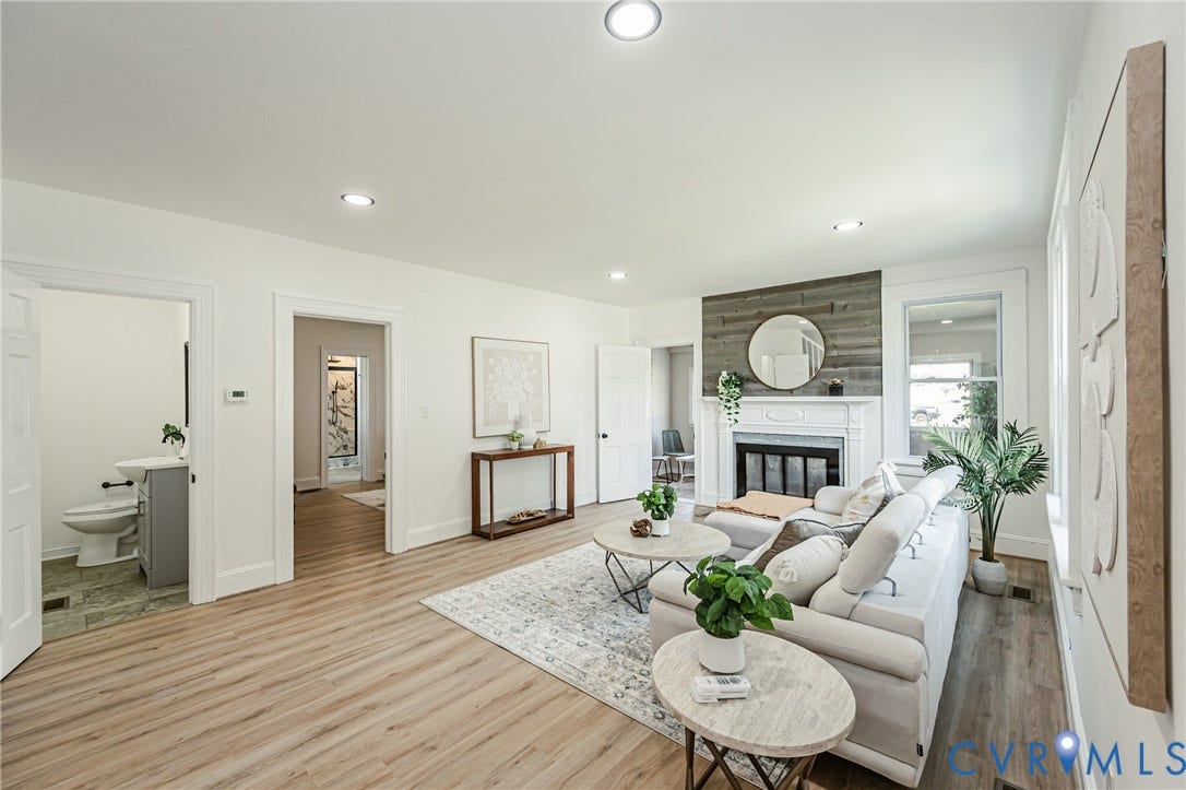 4008 River Road, Chesterfield, VA 23803 Living area featuring wood-finish flooring, recessed lighting, and a fireplace with a decorative mantel and a shiplap accent wall