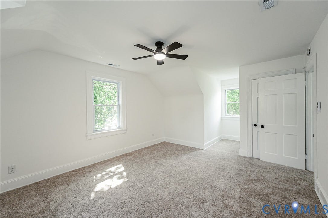 4008 River Road, Chesterfield, VA 23803 Room featuring light-toned carpeting, white walls, and a ceiling fan with integrated lighting