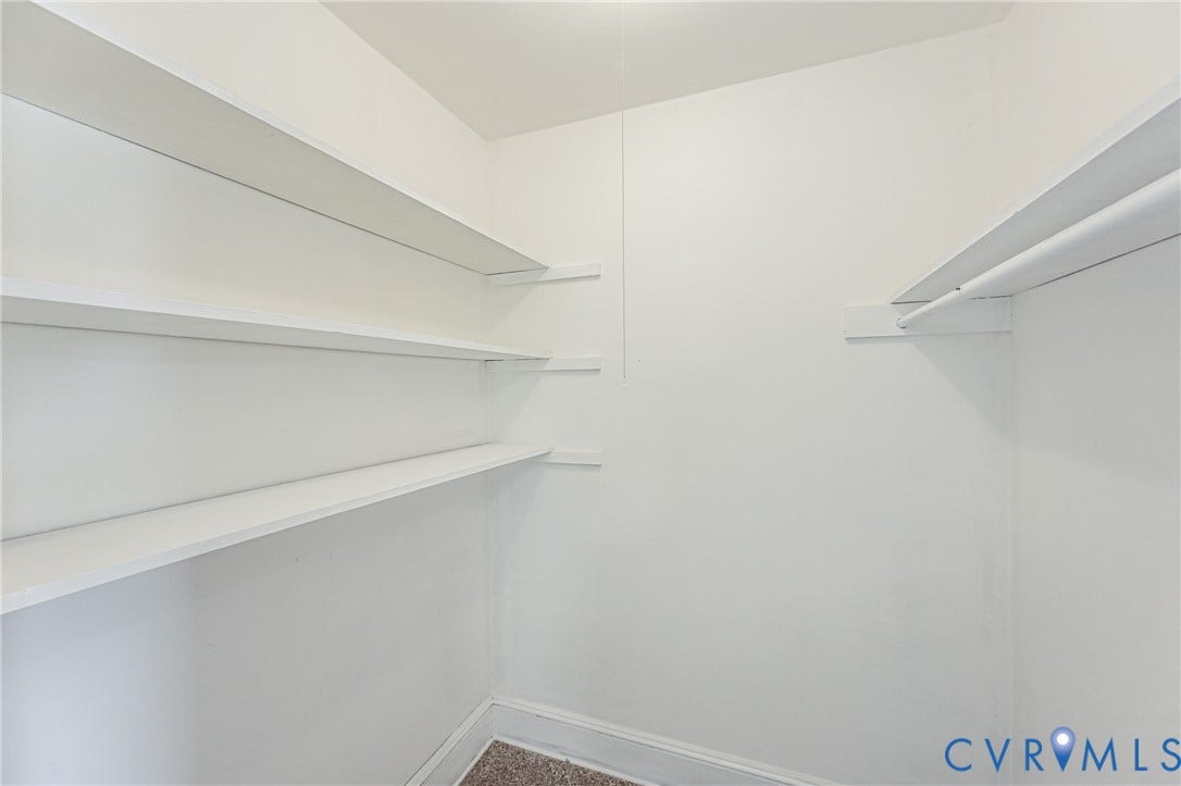 4008 River Road, Chesterfield, VA 23803 Built-in shelving, white painted walls, white trim, and carpet flooring
