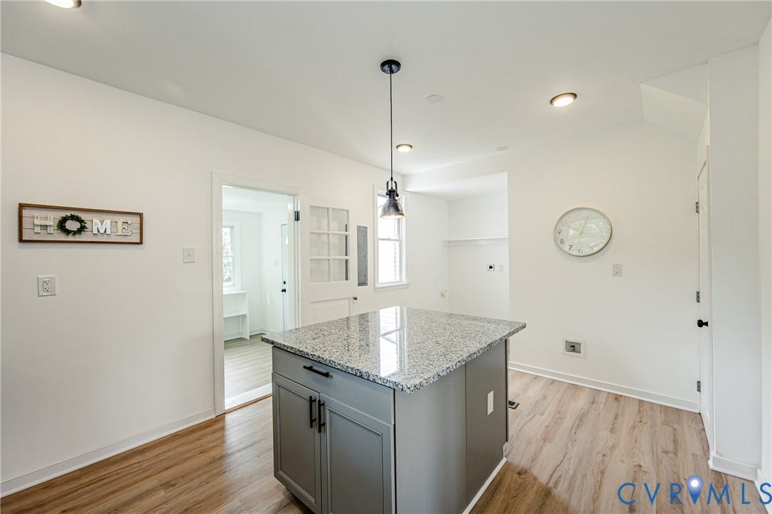 4008 River Road, Chesterfield, VA 23803 Central island with granite-finish countertop and gray cabinetry