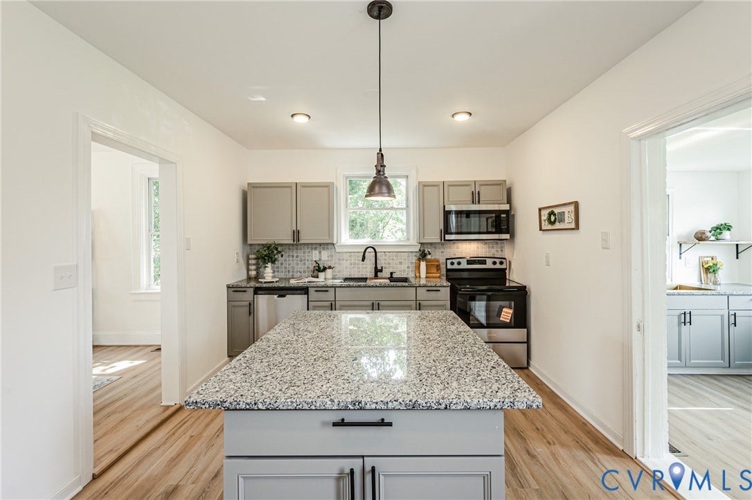 4008 River Road, Chesterfield, VA 23803 Kitchen featuring a granite-top island, wood-finish flooring, recessed lighting, and stainless steel appliances