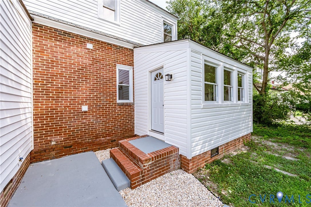 4008 River Road, Chesterfield, VA 23803 Brick and siding exterior featuring an enclosed porch
