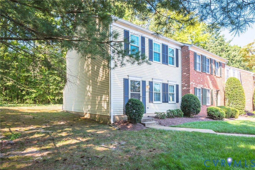 1555 Skirmish Run Drive, #1555, Henrico, VA 23228 Two-story townhome with siding exterior and contrasting dark shutters