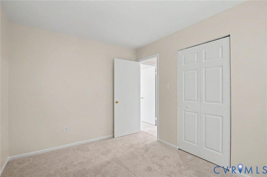 1555 Skirmish Run Drive, #1555, Henrico, VA 23228 Neutral wall finishes, carpeted flooring, and a bi-fold closet door