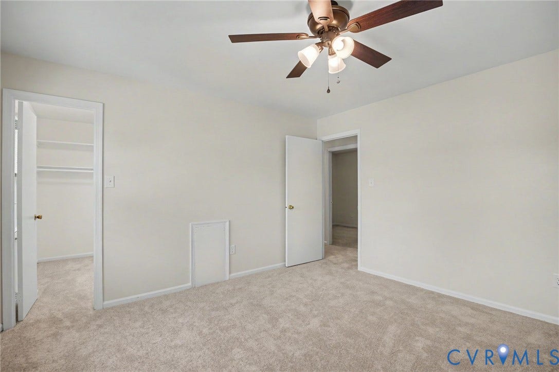 1555 Skirmish Run Drive, #1555, Henrico, VA 23228 Neutral-toned carpeting, ceiling fan with integrated lighting, and a closet with shelving