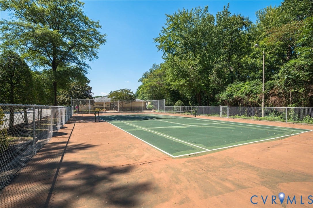 1555 Skirmish Run Drive, #1555, Henrico, VA 23228 Full-size tennis court with a green playing surface and perimeter fencing