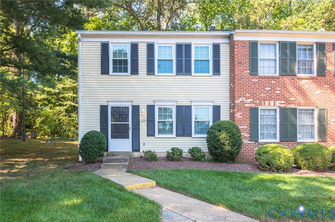 1555 Skirmish Run Drive, #1555, Henrico, VA 23228 Two-story exterior with siding facade, contrasting dark shutters, and a concrete walk-up leading to the front entry