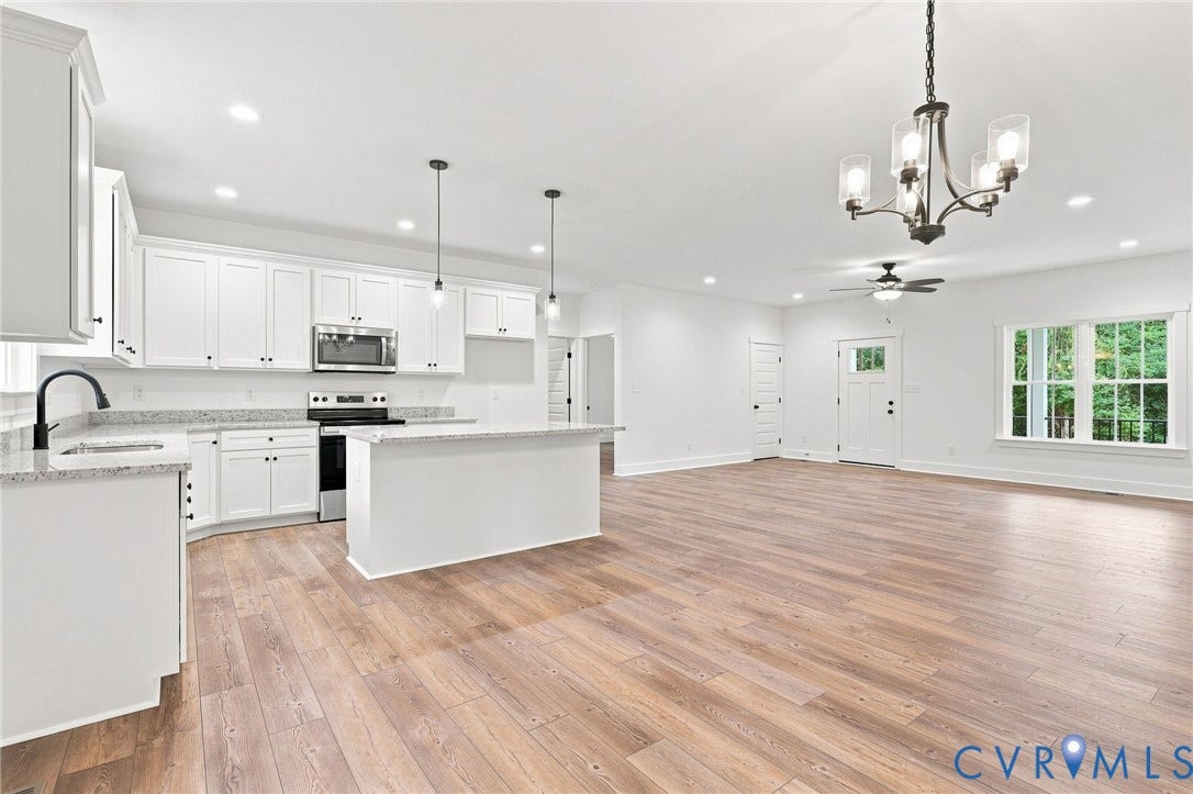 3289 Cumberland Road, Cumberland, VA 23040 Kitchen island with a light-toned countertop and white cabinetry