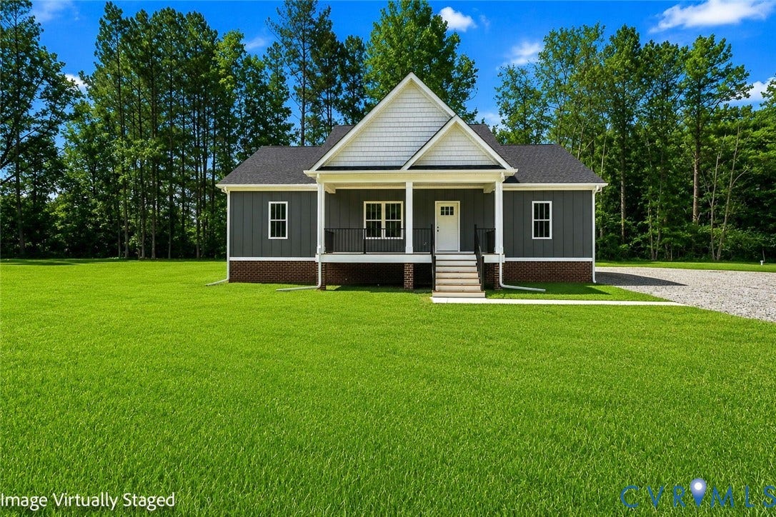 3289 Cumberland Road, Cumberland, VA 23040 Contemporary home exterior featuring dark gray siding, white trim, and a covered front porch with dark railings