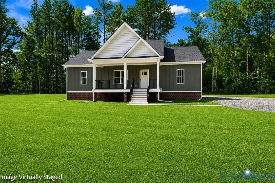 3289 Cumberland Road, Cumberland, VA 23040 Craftsman-style home featuring a dark gray facade, white gables, and a prominent front porch
