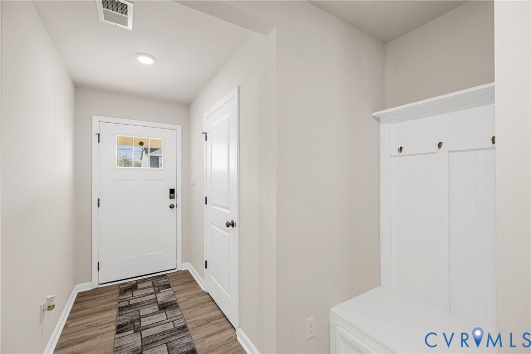 7974 Arbor Marsh Terrace, New Kent, VA 23124 Entryway featuring wood-finish flooring, recessed lighting, and a built-in hall tree with storage and hooks