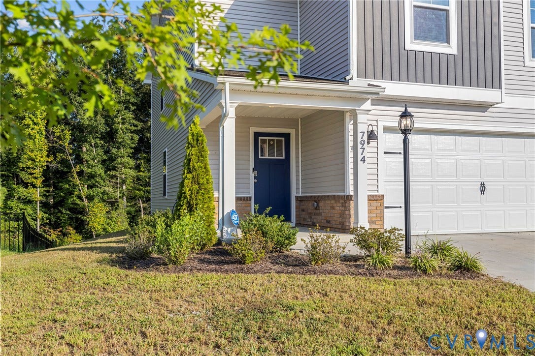 7974 Arbor Marsh Terrace, New Kent, VA 23124 Two-story exterior with mixed siding, covered entry, attached garage, and landscaping