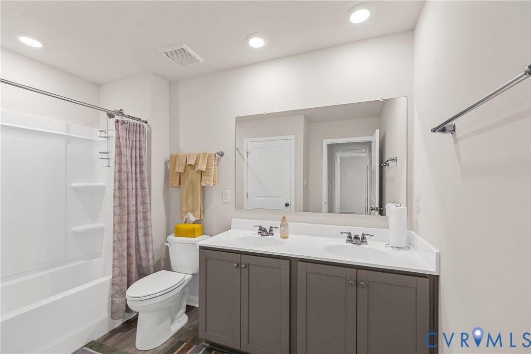 7974 Arbor Marsh Terrace, New Kent, VA 23124 Dual vanity with undermount sinks, white countertop, and gray cabinetry