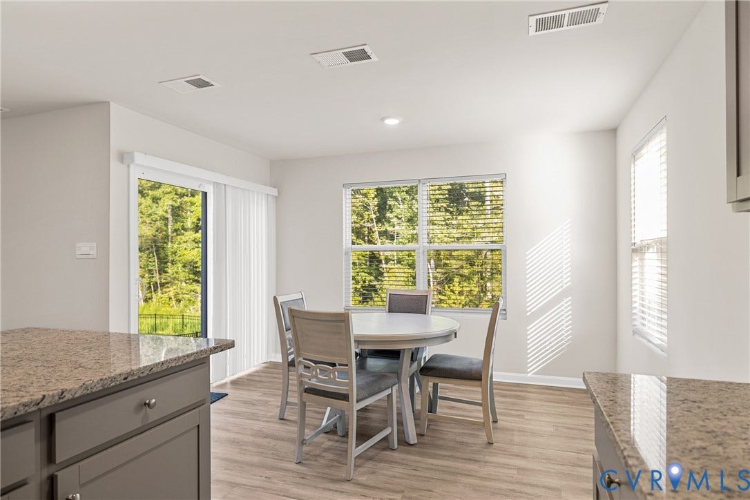 7974 Arbor Marsh Terrace, New Kent, VA 23124 Wood-finish flooring, recessed lighting, and a sliding glass door