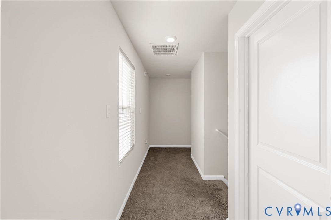 7974 Arbor Marsh Terrace, New Kent, VA 23124 Recessed lighting, window with blinds, paneled door, and carpeted flooring