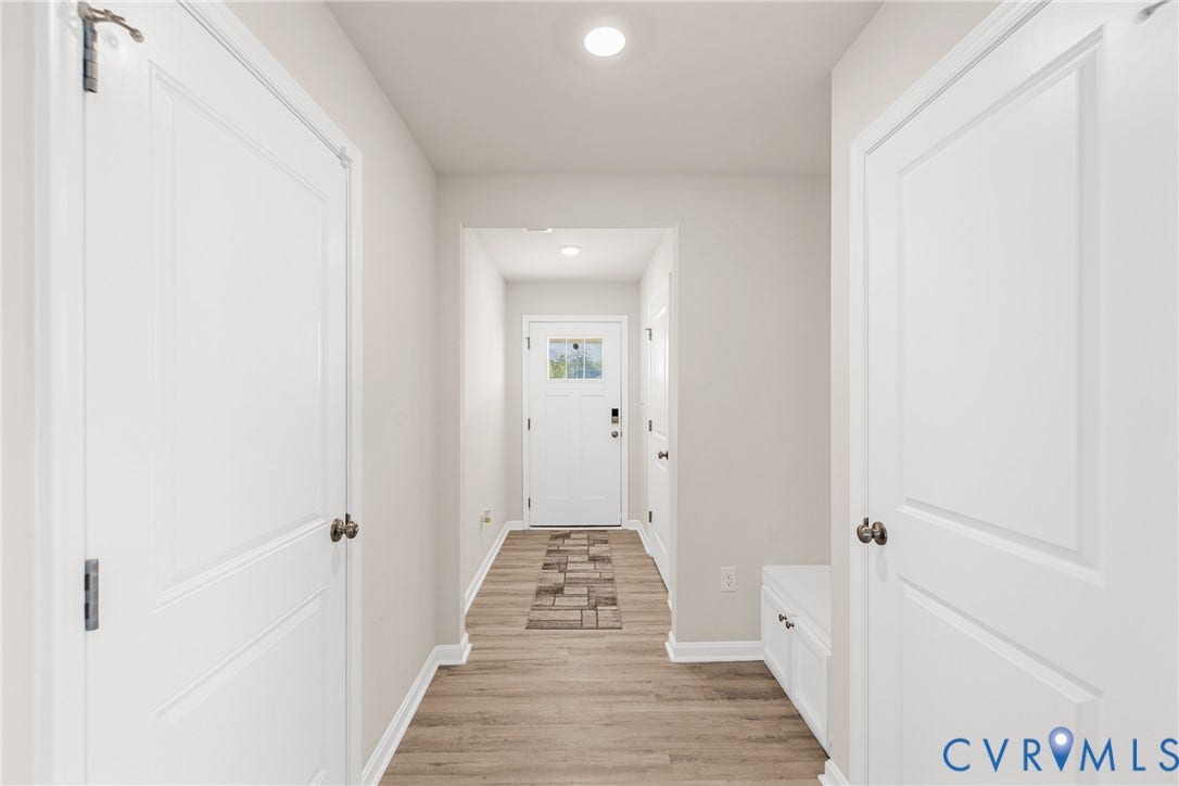 7974 Arbor Marsh Terrace, New Kent, VA 23124 Recessed lighting illuminates the wood-finish flooring