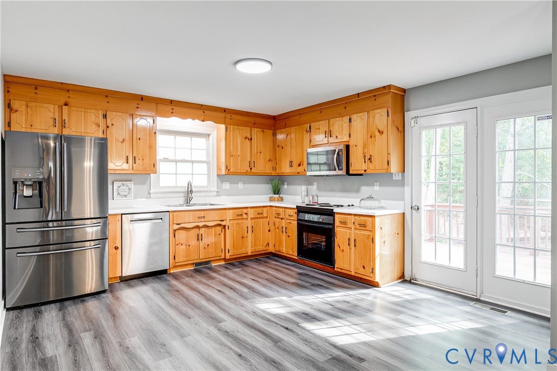 3207 Ludgate Road, Chester, VA 23831 Spacious Kitchen with stainless steel refrigerator, microwave, and dishwaher