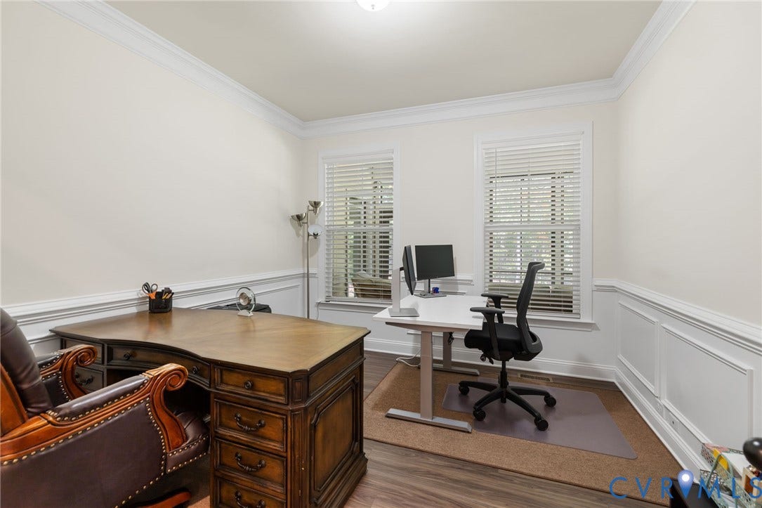 Crown molding, wood-finish flooring, wainscoting, and window blinds