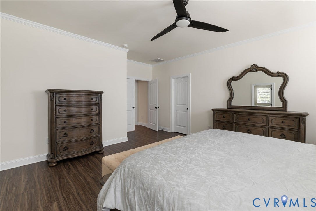 Crown molding, wood-finish flooring, recessed lighting, and a ceiling fan with integrated light