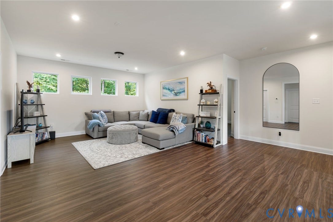 Wood-finish flooring throughout, complemented by recessed ceiling lighting