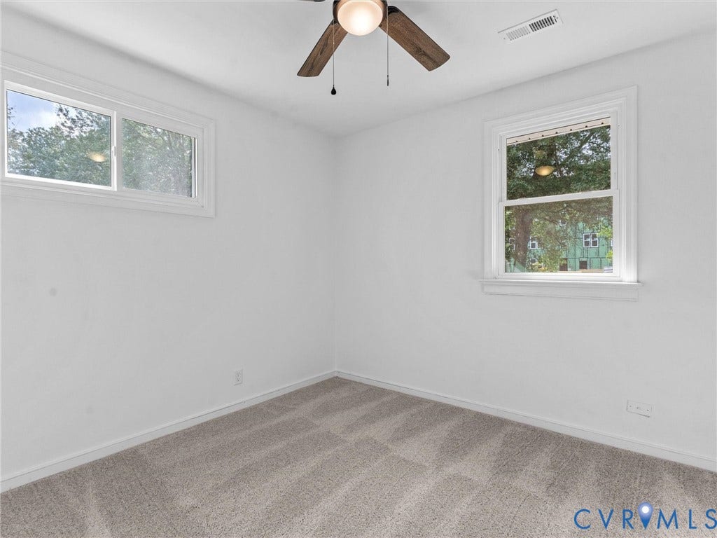 3626 Reynolds Road, Richmond, VA 23223 Room featuring neutral carpeting, white walls, and a ceiling fan with light fixture