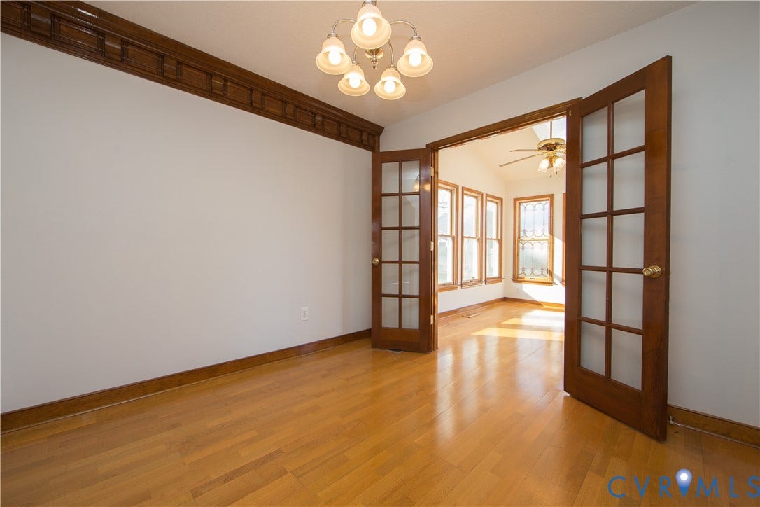 19224 Maurer Lane, Colonial Heights, VA 23834 Hardwood flooring, decorative wall trim, five-light chandelier, double French doors, and bay windows