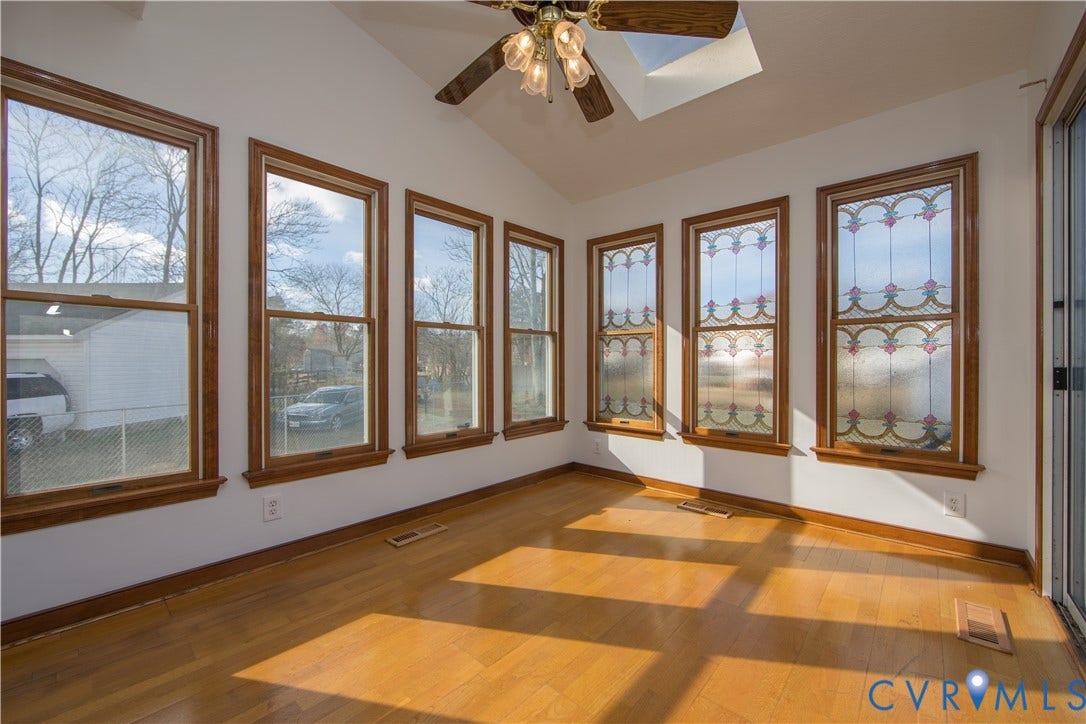 19224 Maurer Lane, Colonial Heights, VA 23834 Vaulted ceiling with skylight, wood-finish flooring, wood-framed windows, stained glass window accents, and a ceiling fan