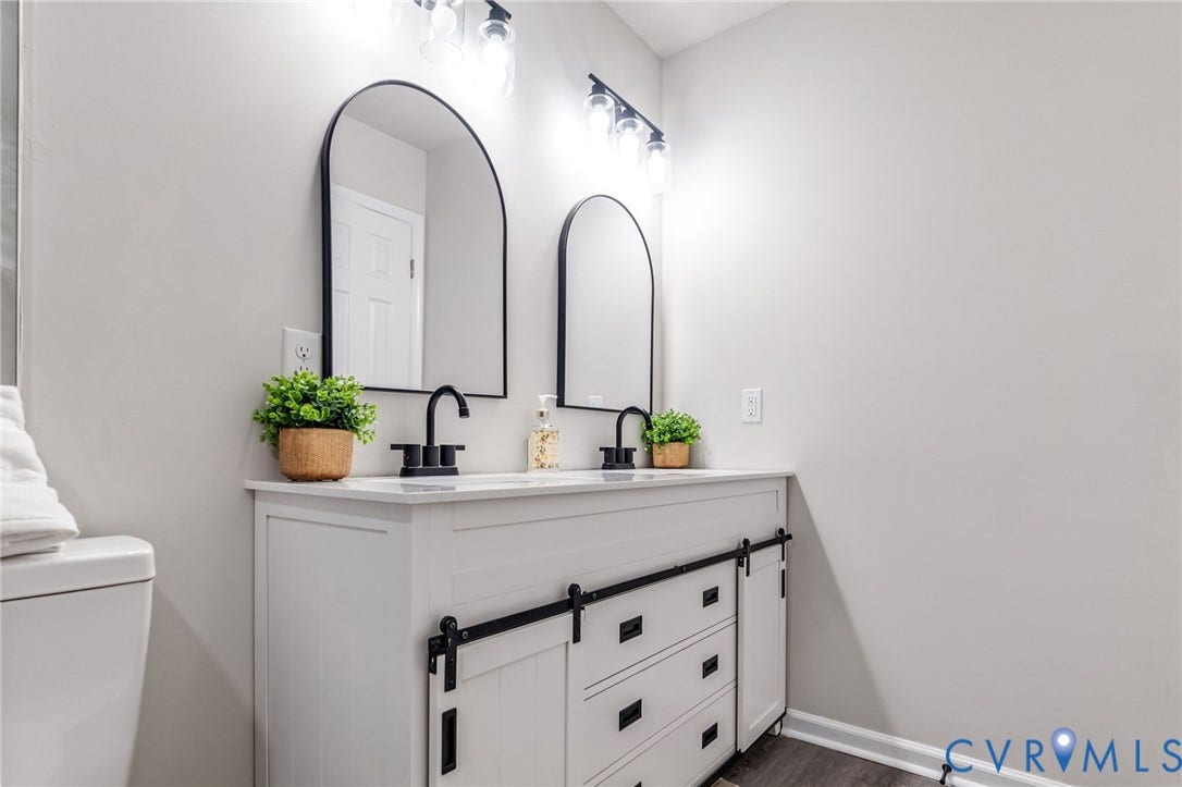 Dual arched mirrors with matte black frames